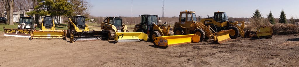 A fleet of Scott's Lawn Care bulldozers in Delano, MN is also used as snow removal equipment in the winter
