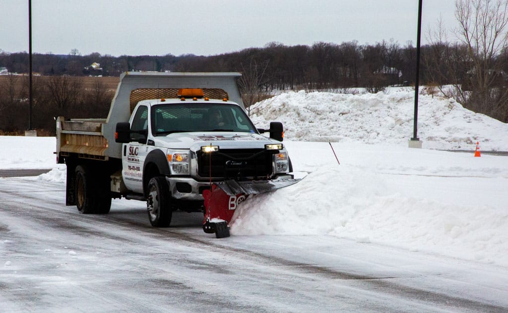 A SLC vehicle plowing snow